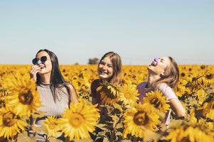 Fun-loving women having fun, enjoying the best reef safe, zinc oxide, biodegradable sunscreen for face in the wild outdoors. 